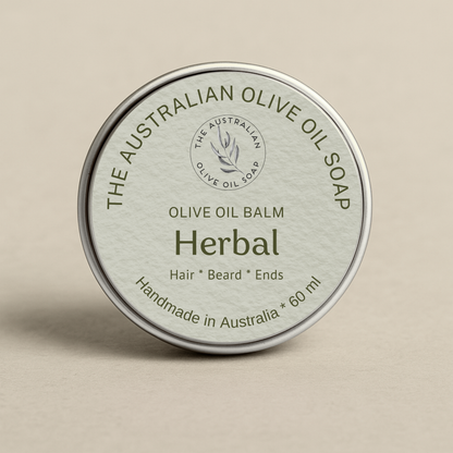 Olive oil balm container with 'The Australian Olive Oil Soap' branding on a beige background