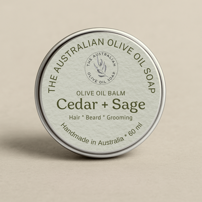 Olive oil balm container labeled 'Cedar + Sage' from The Australian Olive Oil Soap on a beige background